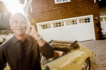 man on phone in driveway